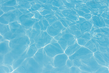 The light reflects blue in the water in the swimming pool. It looks fresh and lively, suitable for use as a wallpaper.