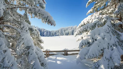 The new deep snow on the wall in the mountains, a walk in the sun and snow.