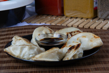 Freshly Made Gyozas with Savory Filling and Soy Sauce