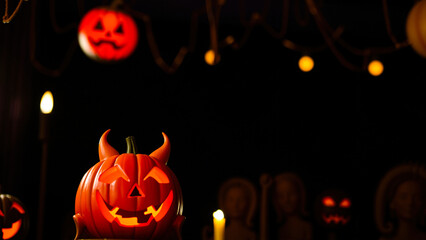 carved pumpkin with devil horns glows the dark