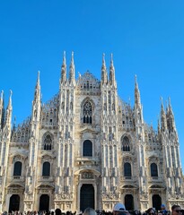 Fototapeta premium 2022.12.27 Milan, Italy, evocative image of the Milan Cathedral in Italy, one of the most important squares in the city