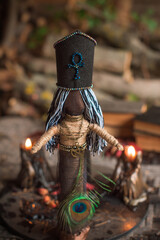 Magic doll for attracting love, rite with voodoo and fate creation, details on a table of witch,...