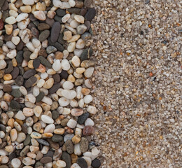 Sea pebbles and sand as a background