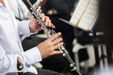 Fototapeta premium Clarinet in the hands of a musician in an orchestra