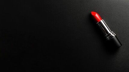 Fototapeta premium Sleek Red Lipstick on Black Surface