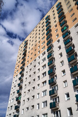 Fototapeta premium The facade with balconies of a residential high-rise building in Poznan