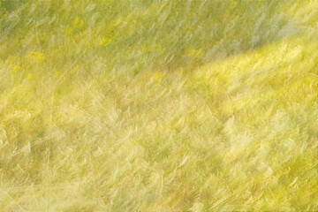 An abstract background of a sunny wildflower meadow with soft yellow and green tones using intentional camera movement. 