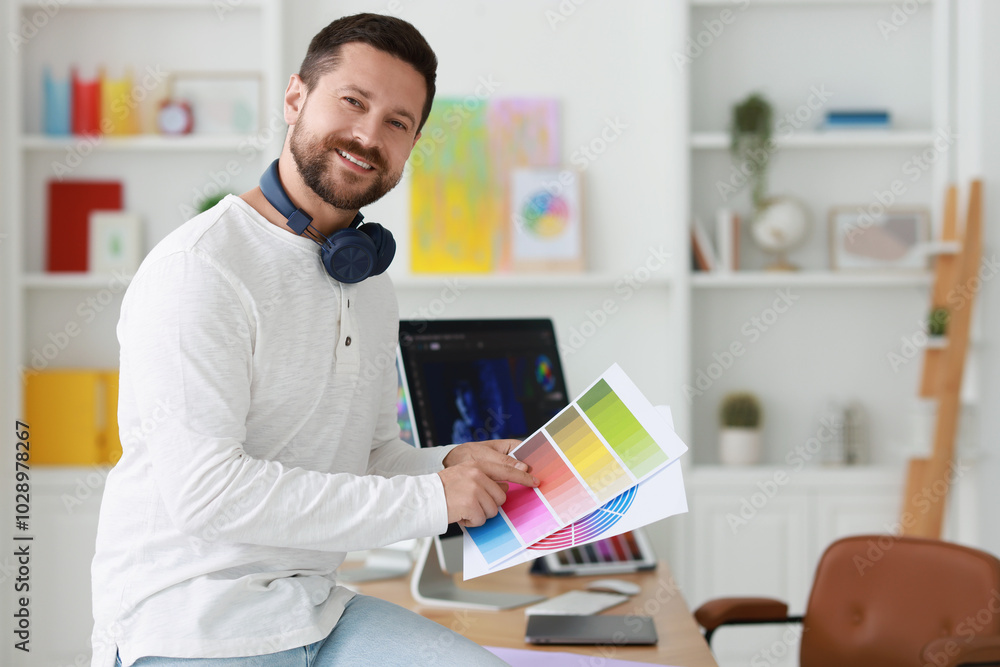 Poster smiling designer with color palette in office