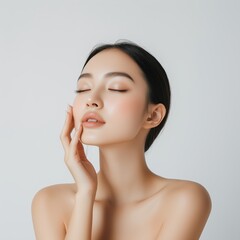 A serene portrait of an Asian woman showcasing her smooth, clear skin. Captivating beauty with a natural and elegant expression ideal for skincare and beauty themes.