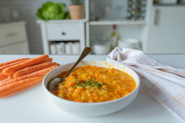 Delicious vegetable soup with carrots and potatoes. Bland food fresh and homemade cooked on kitchen...