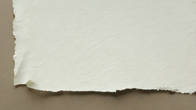 Turned blank page with uneven textured edges. set of torn white paper sheets, zoom in. 4K quality, for opening or closing videos
