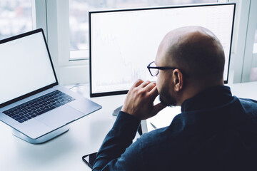 Focused man working on laptop