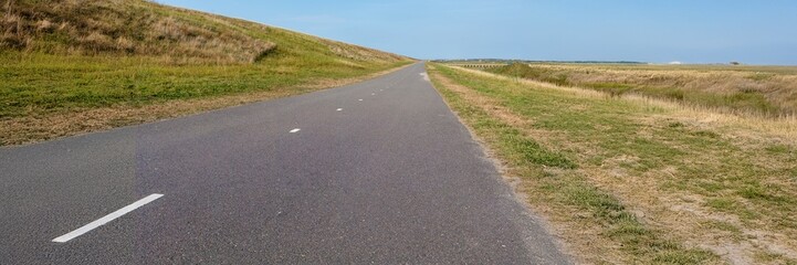 Obraz premium panorama view road in the dunes