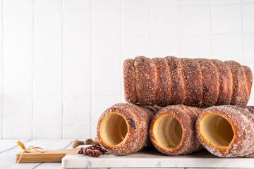 Traditional East Europe Christmas sugar glazed dessert chimney cake, trdlo or trdelnik, sweet...