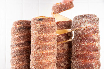 Traditional East Europe Christmas sugar glazed dessert chimney cake, trdlo or trdelnik, sweet...