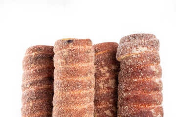Traditional East Europe Christmas sugar glazed dessert chimney cake, trdlo or trdelnik, sweet...