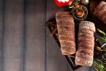 Traditional East Europe Christmas sugar glazed dessert chimney cake, trdlo or trdelnik, sweet...