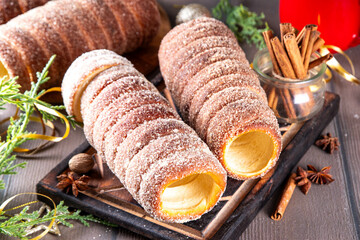Traditional East Europe Christmas sugar glazed dessert chimney cake, trdlo or trdelnik, sweet...