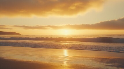 A beautiful sunset over the ocean with a sandy beach in the foreground.