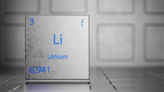 Rotation of a metal cube with the inscription of the chemical element lithium. The element lithium on a metal background. Movement of a metal cube with the inscription of the chemical element lithium.