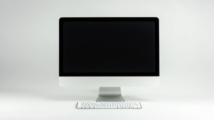Fototapeta premium Close-up of a desktop computer setup against a clean white backdrop.