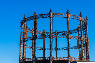 Old retro rusty Gas Holder or Gas tower against a blue sky in Great Yarmouth, Norfolk, UK