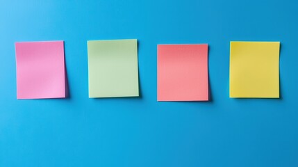 Fototapeta premium Set of colorful sticky notes on blue background. Blank post it memo papers 