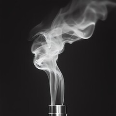 Obraz premium White smoke drifting out of a metal pipe with visible swirls and layers
