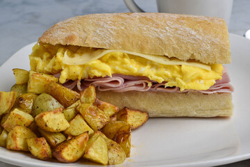 ham , scramble egg and swiss cheese  on ciabatta