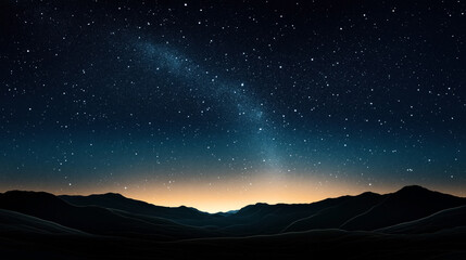 Fototapeta premium Starry night sky with the Milky Way visible over a mountainous landscape with a glow at the horizon, indicating either dawn or sunset.