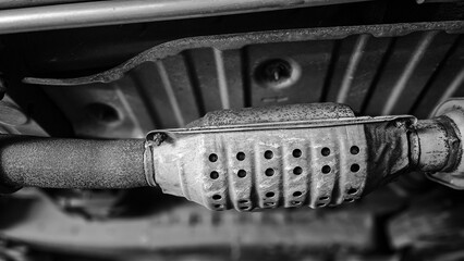 Close-up of catalytic converter monochromatic background