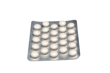 Medical tablets in blister pack on transparent background. White tablets on white.