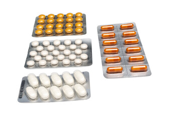 Medical tablets and capsules in blister packs on a transparent white background. Tablets are white and yellow, capsules are orange.