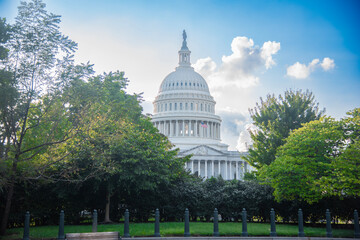 United States Capitol under a blue sky with clouds