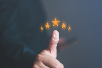 Customer review satisfaction feedback survey concept. Men in suit
Giving Positive services best excellent business rating experience. A smile face on thumb of a businessman chooses give 5 Star.