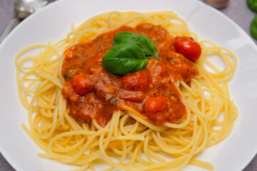 Flat Lay of Delicious Spaghetti Napoli with Fresh Tomatoes, Garlic, and Basil