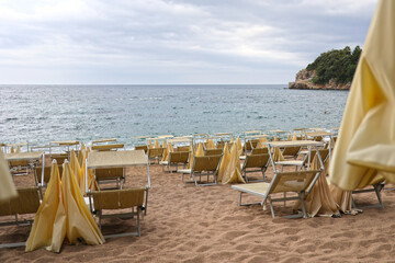 Empty sun loungers on the beach as a background.