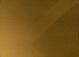 A brown fabric with a pattern of lines and dots