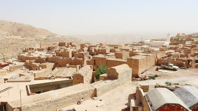 Stone houses of mountainous village of Toujane attracting tourists with traditional architecture 