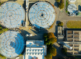 A view of a large industrial plant with three large tanks