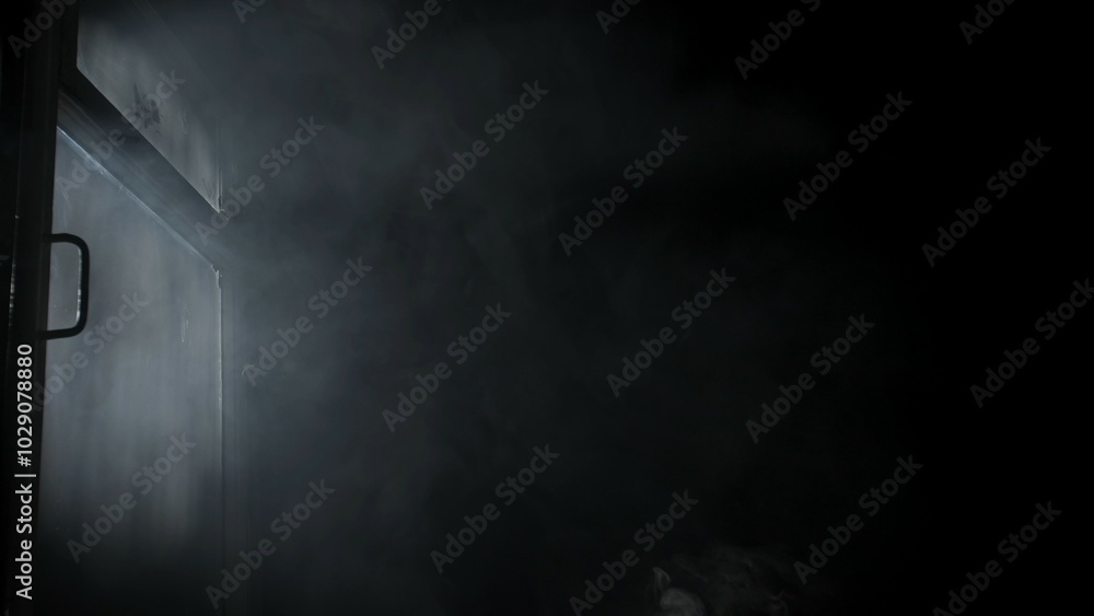 Wall mural soft diffused rays of light illuminate the foggy darkness and the window.