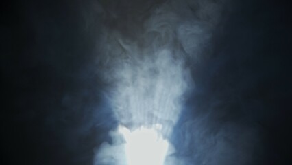 Soft diffused rays of light cut through the hazy darkness.