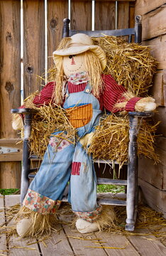 Handmade straw man or woman decoration for fall or Halloween. 