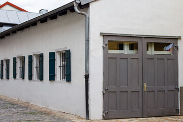 old german building. white building with grey gates