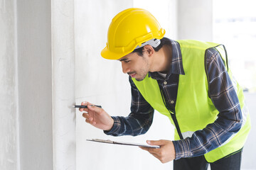 Building inspection asian contractor young man, male inspecting home, reconstructed construction,...