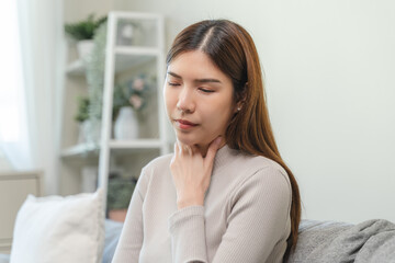 Naklejka premium Female unhealthy Sickness, asian young woman, girl unwell and coughing, have cold, sore throat isolated white background suffering with symptom cough feeling bad. Healthcare of Coronavirus, covid-19.