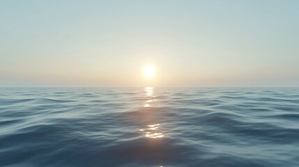 Obraz premium A calm ocean surface with soft waves reflecting the light of the setting sun.