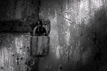 Old rusty lock on metal doors. Lock on the door with an empty place for an inscription