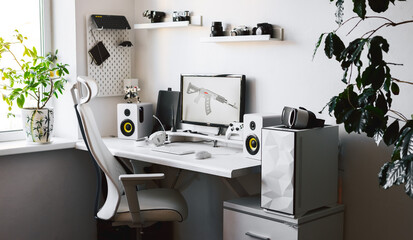 General view home workplace of gamer with computer and gamepad.  © Aboltin