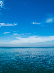 Obraz na płótnie Canvas Landscape beautiful summer vertical wide horizon look viewpoint shore open sea beach cloud clean and blue sky background calm nature ocean wave water nobody travel at thailand chonburi sun day time